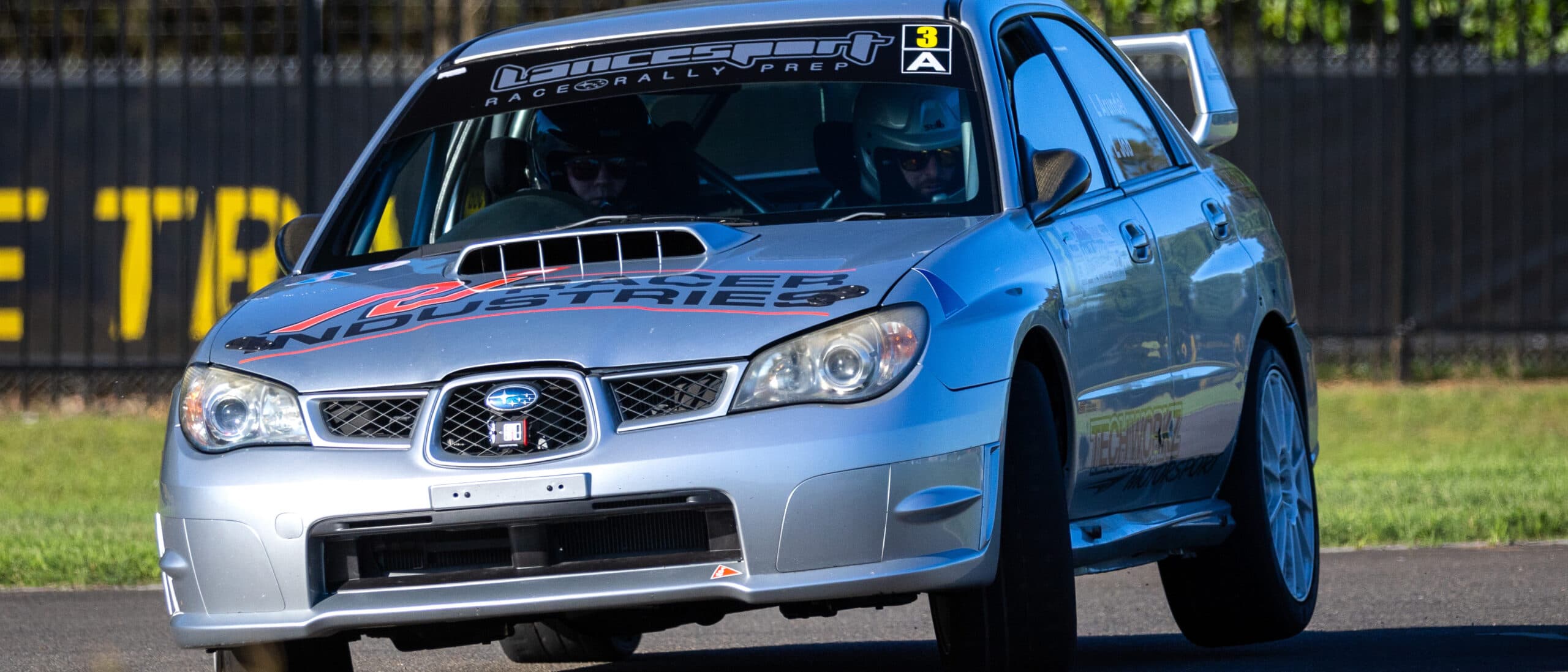 A rally car sliding through a corner during the Tarmac Sprint Series at Sydney Dragway